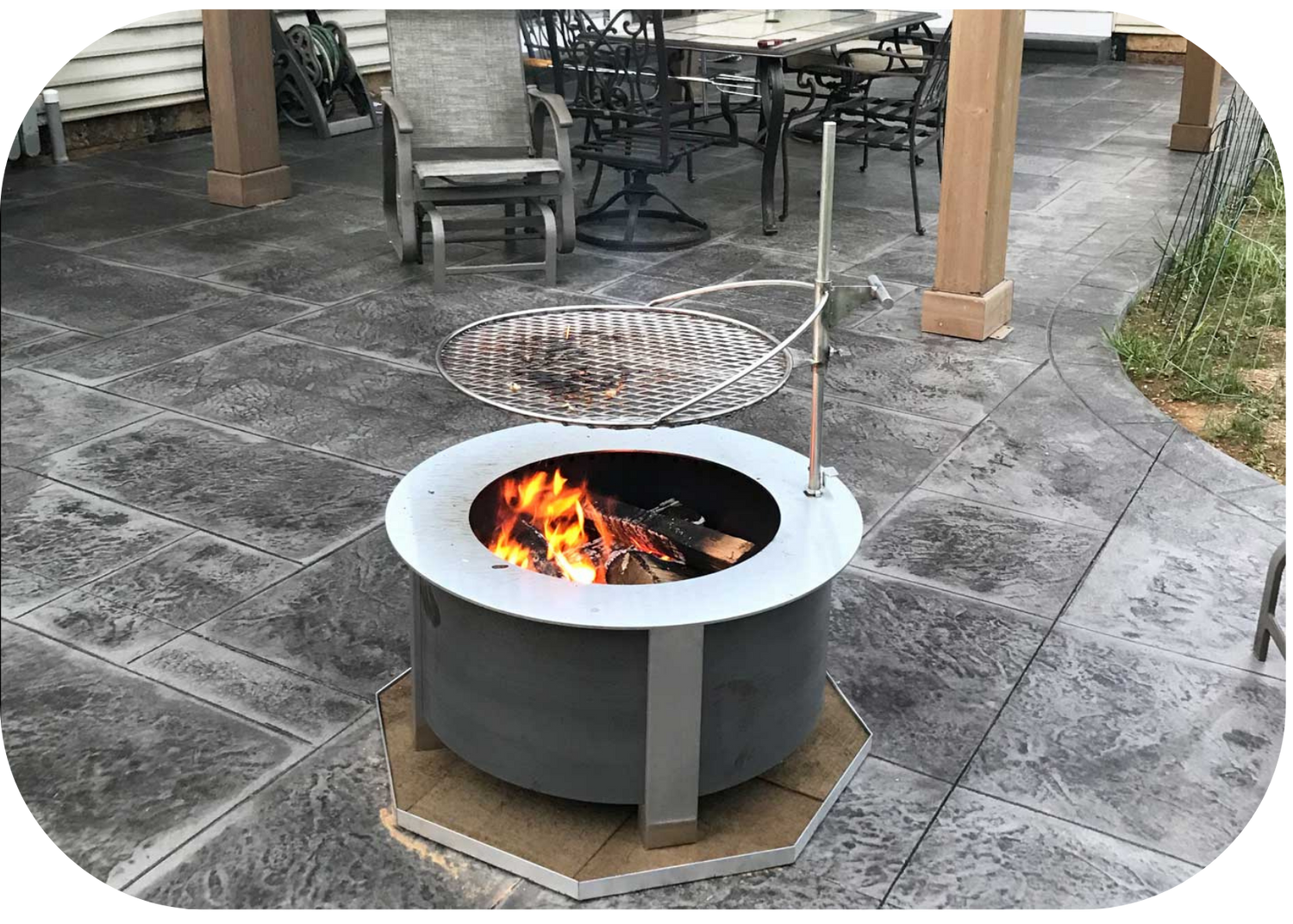 a fire pit with a grill over it