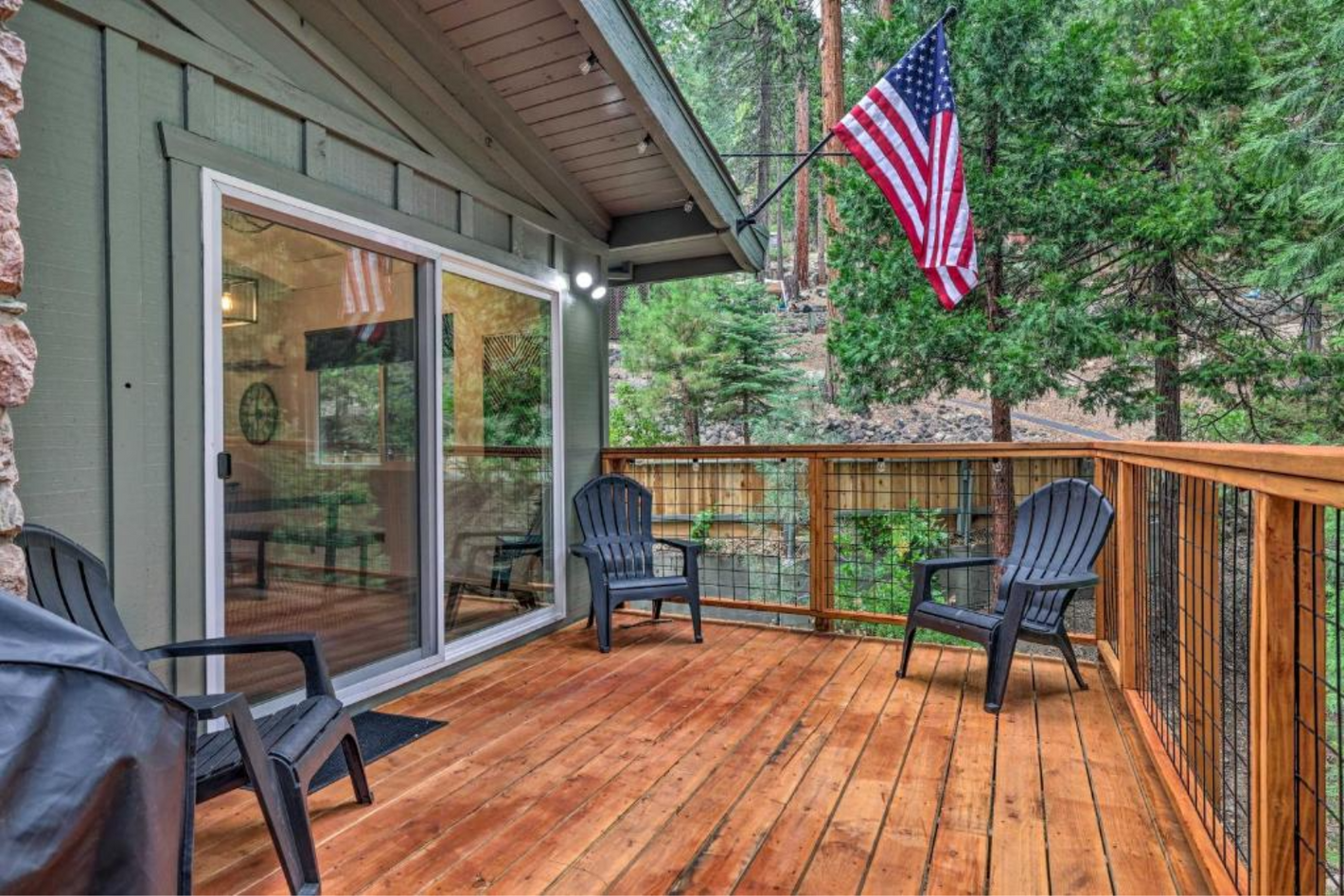 a deck with chairs and a flag on it